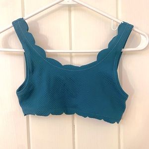 a teal scallop-trim bikini